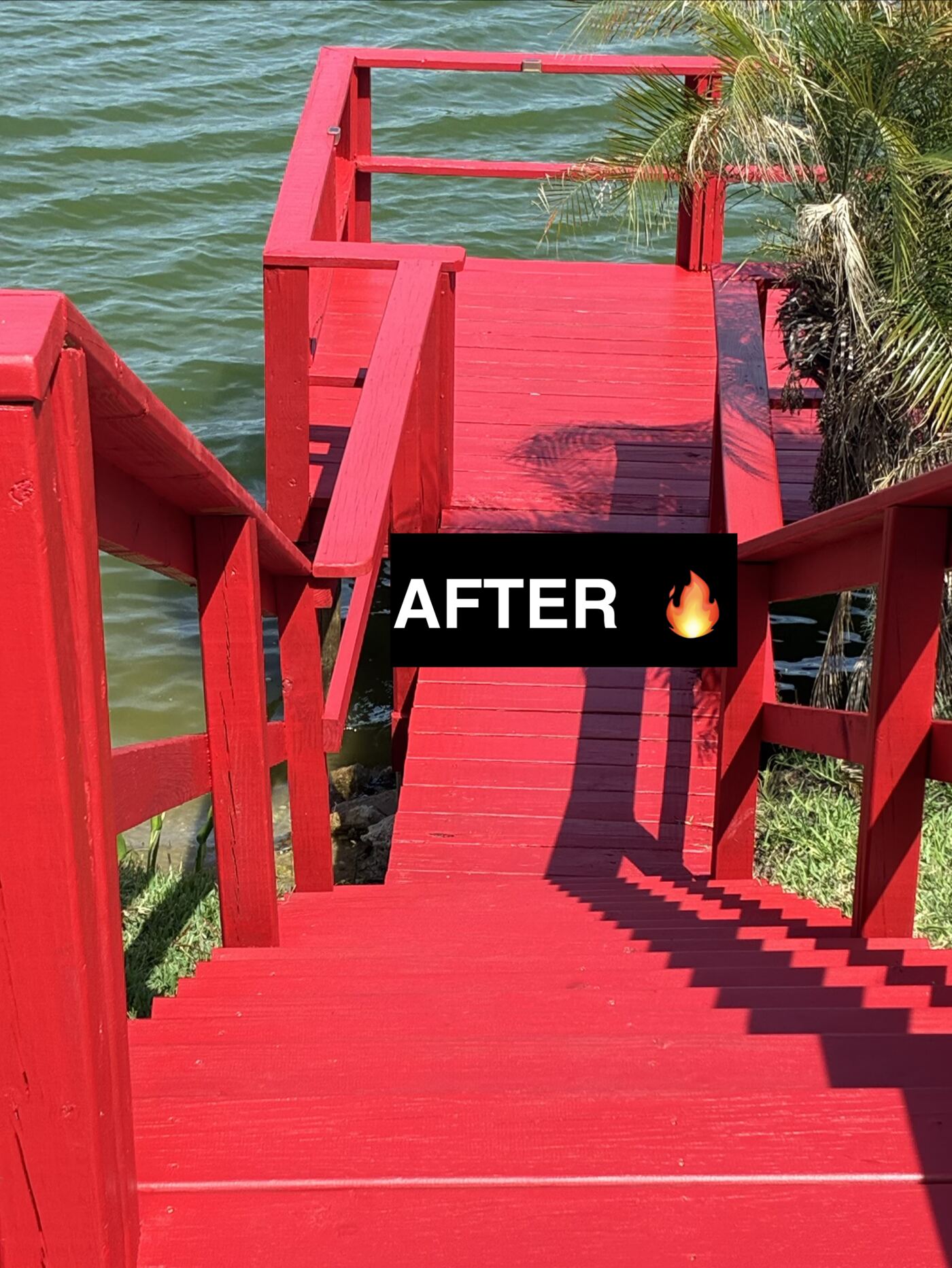 Lakeside dock after restoration with fresh red paint