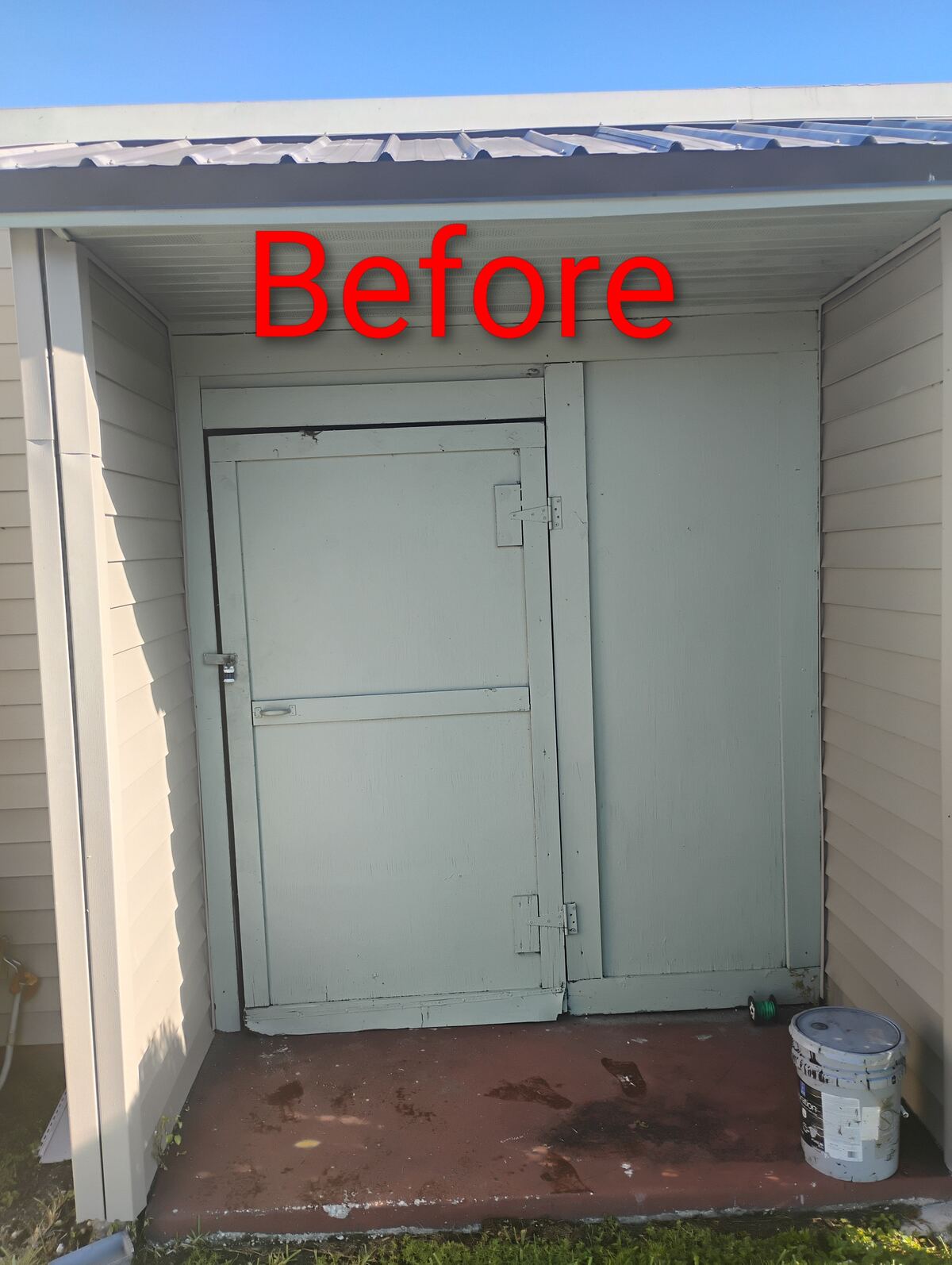 Storage shed doorway before new doors