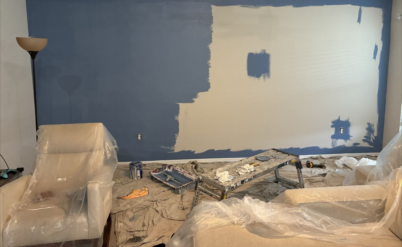 Living room accent wall mid-prep before paint and molding